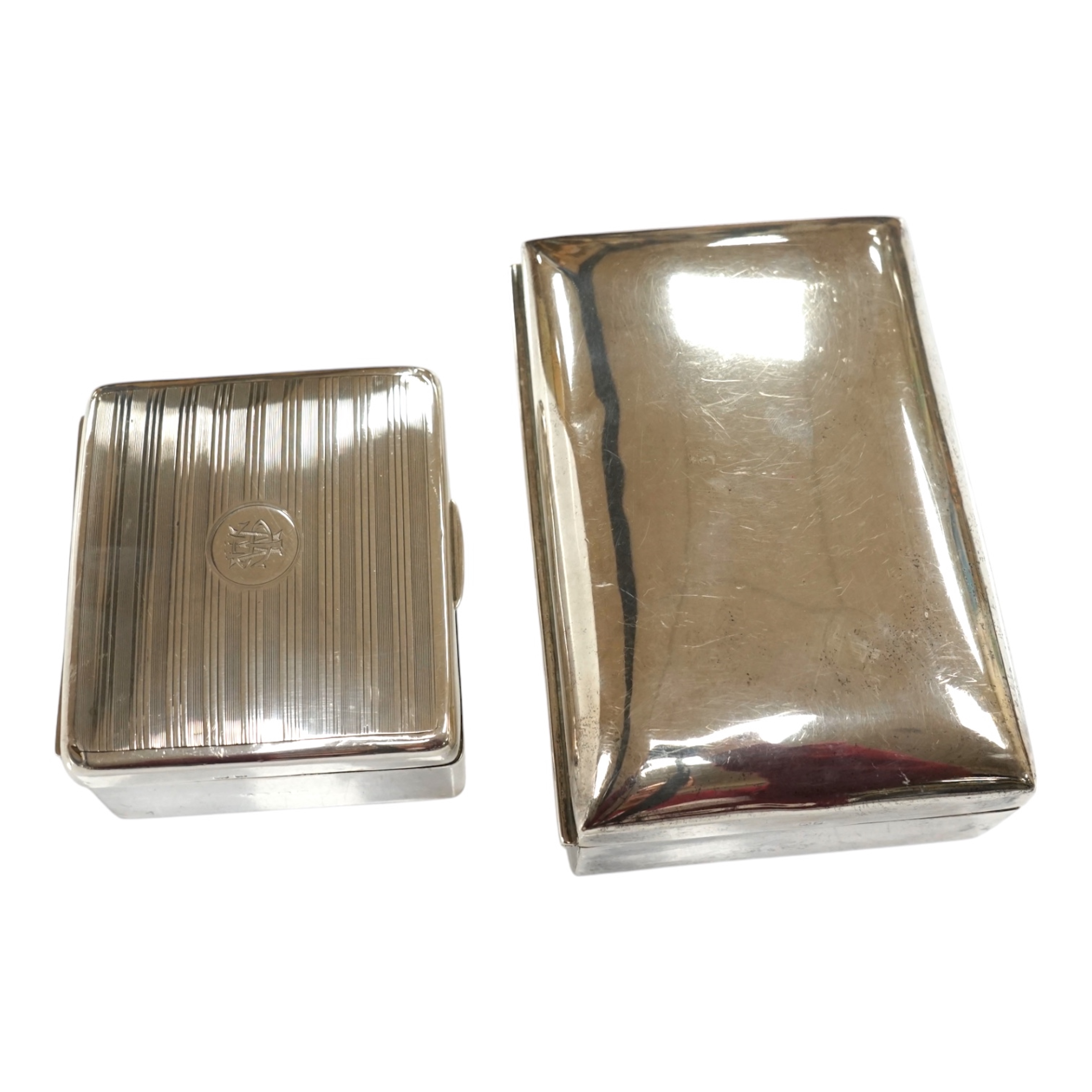 Two silver cigarette boxes, the largest by Stokes & Ireland, Chester, 1906, 14.7cm. Condition - poor to fair